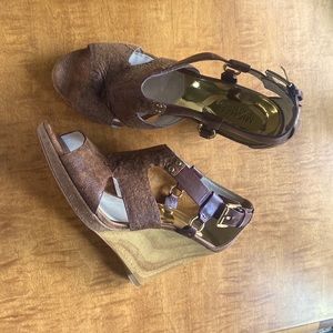 Michael Kors Briyette Wedge sandals. These sandals will give you shapely legs.